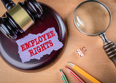 Gavel and 'Employee Rights' note representing workplace accommodation legal protections.