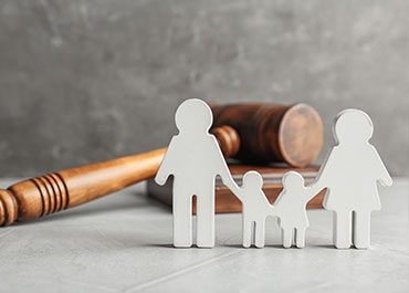 California Family Rights Act updates—family cutout with gavel representing legal protections.